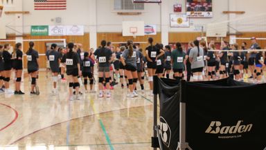 Players wearing numbered tryout jerseys gathered on the court at Aftershock tryouts